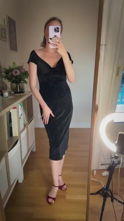 Video of a woman in black velvet tango dress